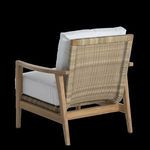 Back angle showing woven wicker backrest attached to teak frame with white cushion