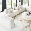 Nest Modular Sectional in living room setting with curved back sections and decorative pillows