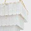 Close-up showing detailed alabaster panel texture and brass fasteners on Moissanite chandelier