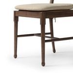 Cushion-backed seat tied to chair frame with visible linen fabric texture