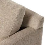 Close-up angle showing back cushion resting snugly against armrest