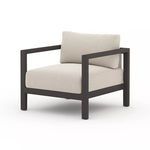 Sonoma Faye Sand Outdoor Chair with wide dark aluminum frame and deep neutral textured cushions