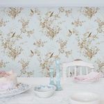 Wallpaper applied on wall in a styled white dining room with vintage tableware and pastel accents