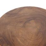 Straight angle view of table highlighting smooth edges and carved triangular leg design