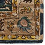 Extreme close-up on beige and blue floral pattern with thick hand-tufted pile