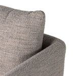 Front angle close-up highlighting plush seat cushion layering and swivel base