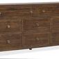 Eight-drawer dresser in worn saddle finish with brass knobs and visible wood grain texture
