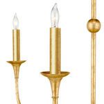 Candle-style bulb sockets glowing, focused on one bulb with small textured gold arm beside it