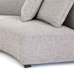 Two square back cushions resting on curved backrest in grey fabric upholstery