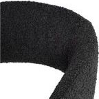 Close-up of licorice boucle fabric texture on chair’s curved backrest