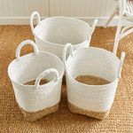Top angled view showing interior color contrast of Madura Market baskets with woven bottoms