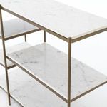 Top view close-up of polished white marble surface with antique brass framing