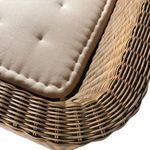 Close-up of curved weave along armrest of bench with cushion edge