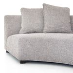 View of sectional corner showing armrest height relative to seat and block legs
