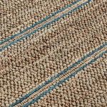 Close-up showing tightly looped jute fibers and blue woven accent stripes in rug texture