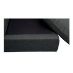 Close-up of sectional seat cushion partially lifted revealing black mesh base underneath
