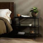 Jasper Nightstand styled beside a bed with books, plant, and coffee mug, showing room context
