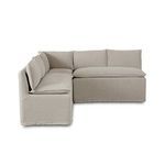 Opposite side angle showing full back cushions and streamlined skirted slipcover