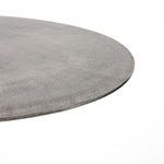Another view of tabletop edge with worn and slightly uneven raw antique nickel finish