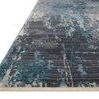 Close-up angled side view highlighting rug’s texture and fringe edging