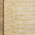 Close-up corner of Santa Fe Rug on wood floor showing mixed beige and yellow tones