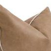 Close-up highlighting smooth vegan leather texture and contrast cream piping along pillow edge
