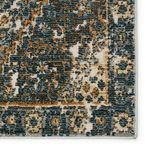 Detailed corner close-up highlighting intricate faded diamond motifs and border