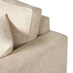 Side view close-up of overlapping back cushions and armrest seam detail