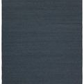 Handwoven solid deep blue indoor outdoor rug with natural texture, 8 by 10 feet.