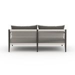 Close rear view of Sherwood sofa showing detailed light neutral woven straps against charcoal frame.