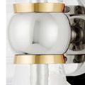 Close-up of polished nickel spherical center with brass bands on hammered glass cones