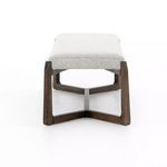 Bench end view showing the rectangular cut-out design of the wood legs and fabric seat profile