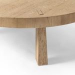Close-up of exposed pull-through joinery on thick oak table edge