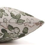 Close-up of pillow’s textured linen fabric and visible seam along the edge with leafy print in soft dusty rose and cypress...