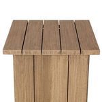 Overhead close-up of five teak slats forming the flat table top