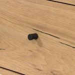 Smooth oak wood surface close-up showing natural light tone and fine grain