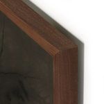 Close-up of walnut frame corner highlighting smooth grain and joinery