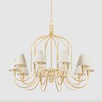 Warrensburg Chandelier shown hanging in neutral room setting with linen shades and warm lighting.