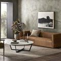 living room view with jute rug under coffee table, showing interaction with hardwood flooring and furnishings