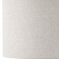 Close-up view of the fabric texture of the beige drum lamp shade