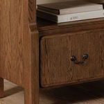 Close-up of bottom drawer front highlighting rounded edges and metal pull handle on Caroline bookcase