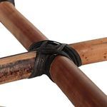 Detail of rattan pole joints wrapped in dark binding showing natural material grain