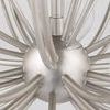 View from below showing chandelier's central metal sphere and radiating arms