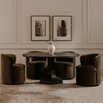 Four Dane swivel dining chairs around round black dining table in neutral dining room