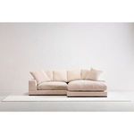 Plunge sectional with chaise on right side displayed against white backdrop on white rug