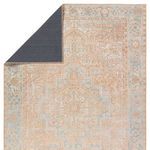 Back corner flipped to reveal dark solid underside backing of the rug