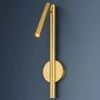 Circleville Wall Sconce mounted on dark blue wall with spotlight turned on