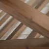 Focused view along angled wooden slats making up the trestle base