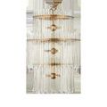 Three-tier chandelier with antique brass rings and two sizes of clear glass bars resembling icicles