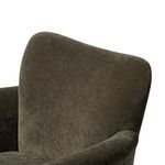 Close-up of upper curved backrest section showing soft fabric texture and seam.